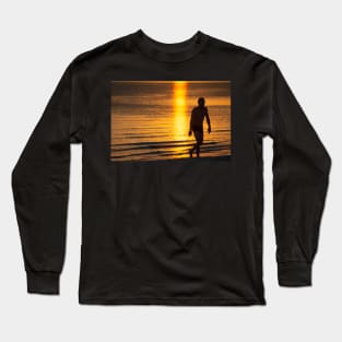 Silhouette of man in the golden light at St KIlda Beach, Melbourne. Long Sleeve T-Shirt